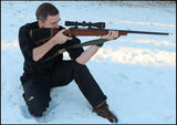 Riflecraft founder in a kneeling unsupported shooting position with his shooting sling