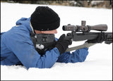 Riflecraft founder prone in the snow with a Rifleman's Essential Shooting Sling